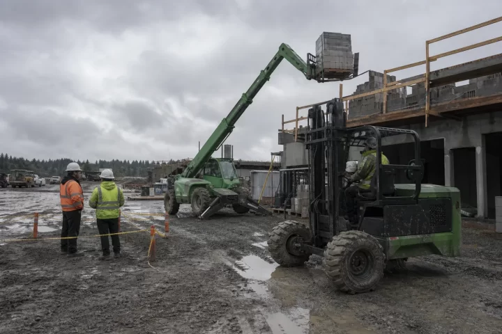 Telehandler and rough-terrain forklift equipment at a jobsite