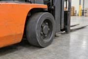 Compact cushion forklift wheel on a smooth warehouse floor
